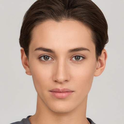 Neutral white young-adult female with short  brown hair and brown eyes