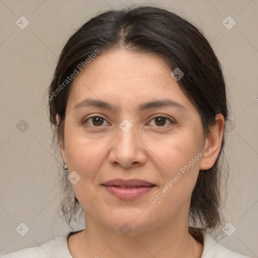 Joyful white adult female with medium  brown hair and brown eyes