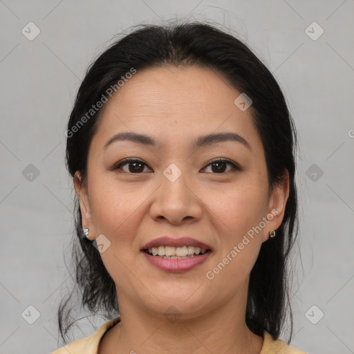 Joyful latino young-adult female with medium  brown hair and brown eyes