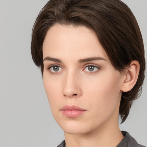 Neutral white young-adult female with medium  brown hair and brown eyes