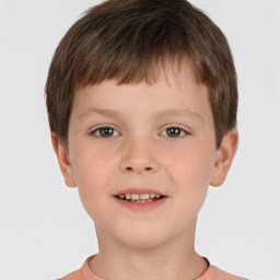 Joyful white child male with short  brown hair and brown eyes