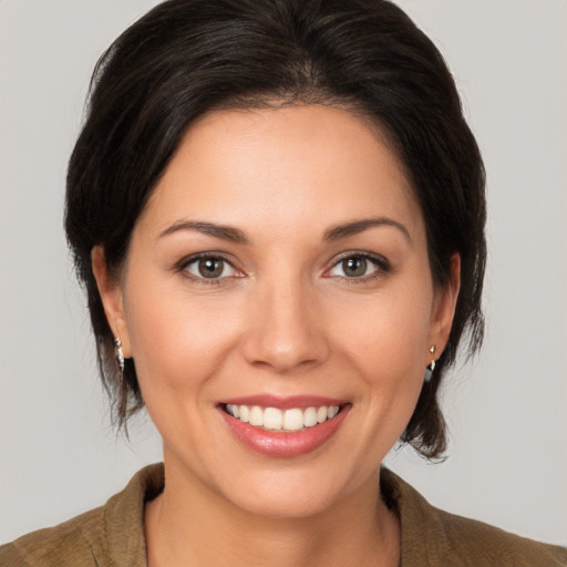 Joyful white young-adult female with medium  brown hair and brown eyes