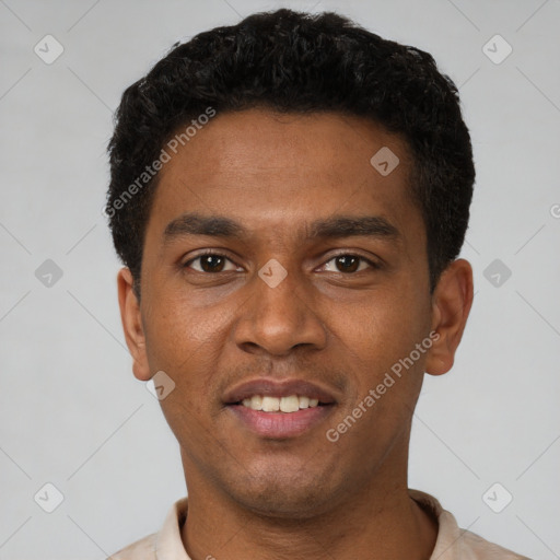 Joyful latino young-adult male with short  brown hair and brown eyes