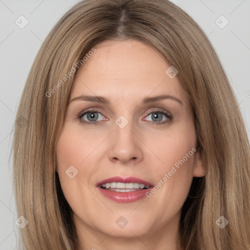 Joyful white adult female with long  brown hair and grey eyes