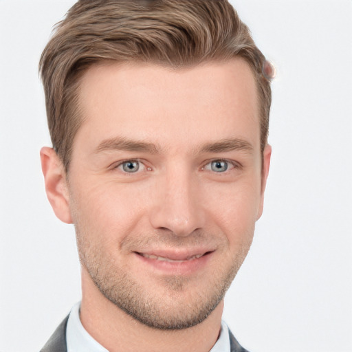 Joyful white young-adult male with short  brown hair and grey eyes