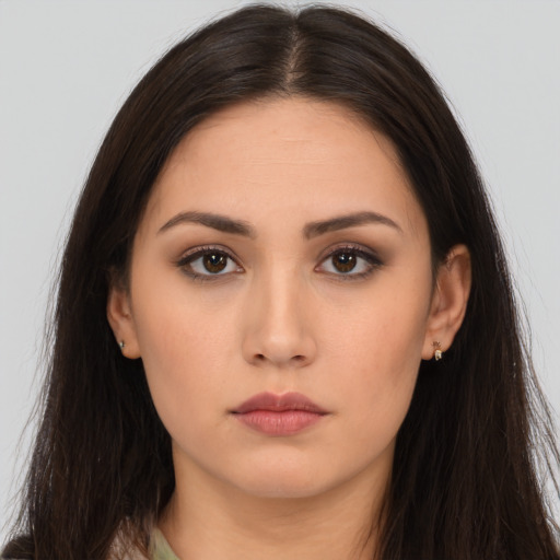 Neutral white young-adult female with long  brown hair and brown eyes