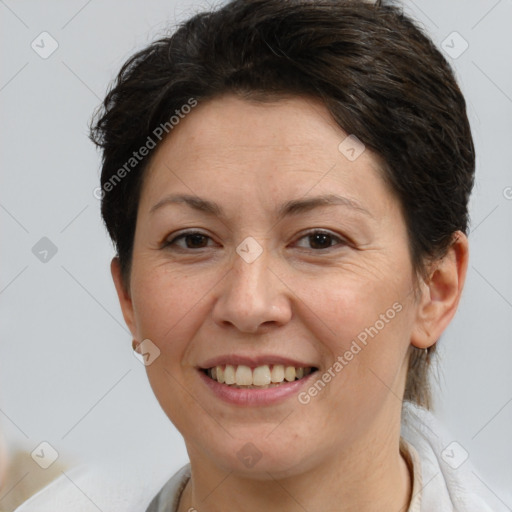 Joyful white adult female with short  brown hair and brown eyes