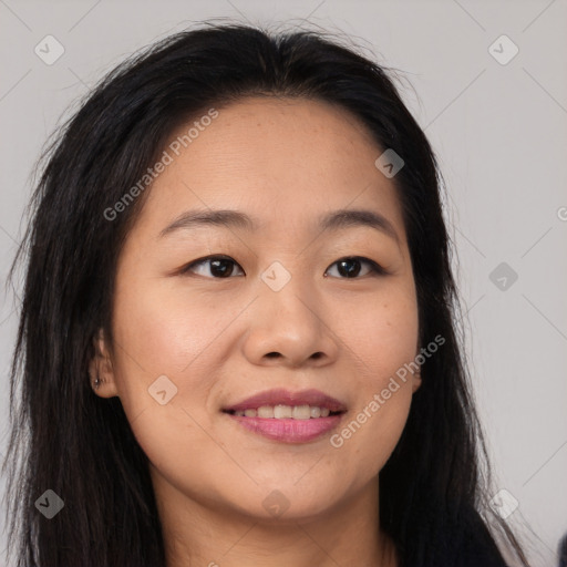 Joyful asian young-adult female with long  brown hair and brown eyes