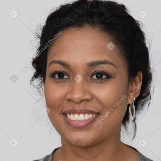 Joyful latino young-adult female with long  brown hair and brown eyes