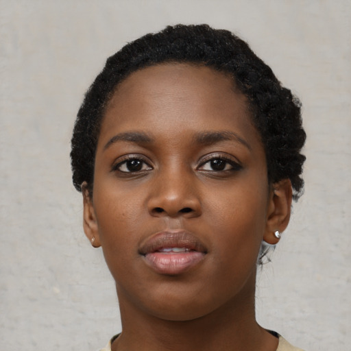 Neutral black young-adult female with short  black hair and brown eyes