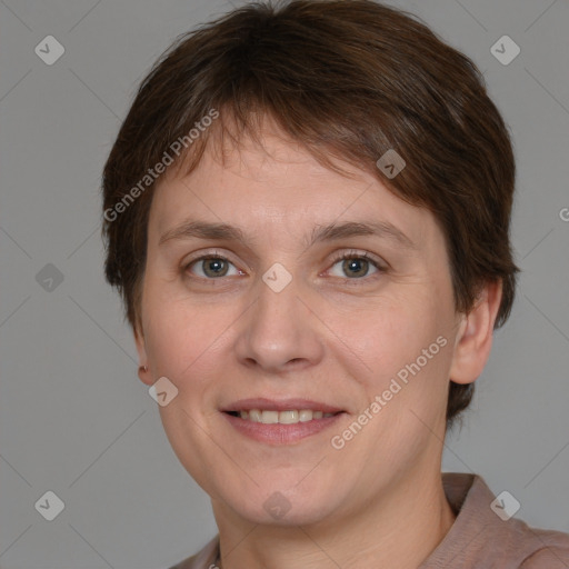 Joyful white young-adult female with short  brown hair and grey eyes