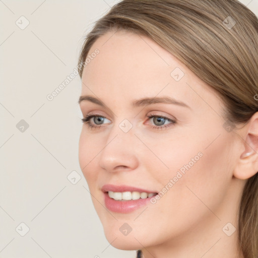 Joyful white young-adult female with long  brown hair and blue eyes