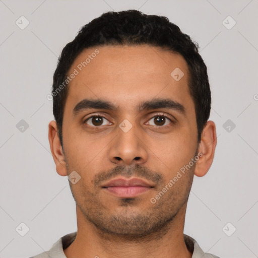 Neutral latino young-adult male with short  black hair and brown eyes