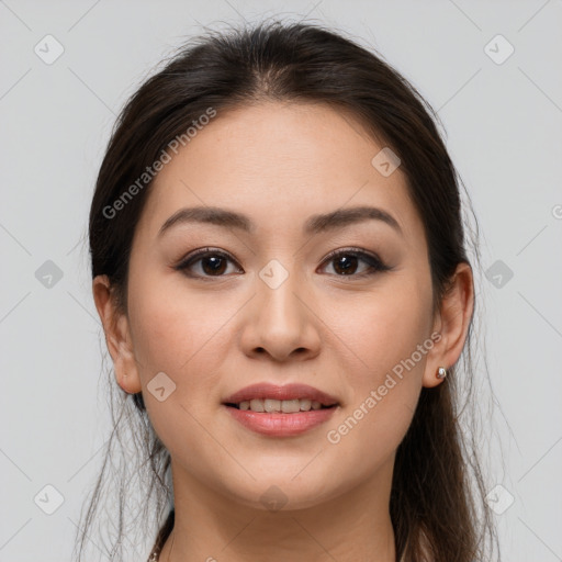 Joyful white young-adult female with long  brown hair and brown eyes