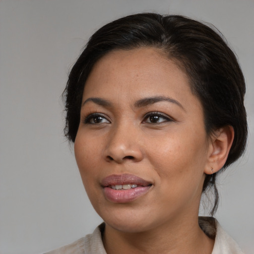 Joyful asian young-adult female with medium  brown hair and brown eyes