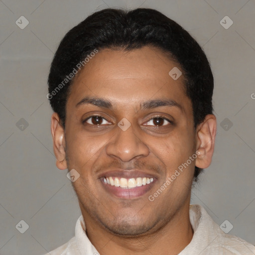 Joyful latino young-adult male with short  black hair and brown eyes