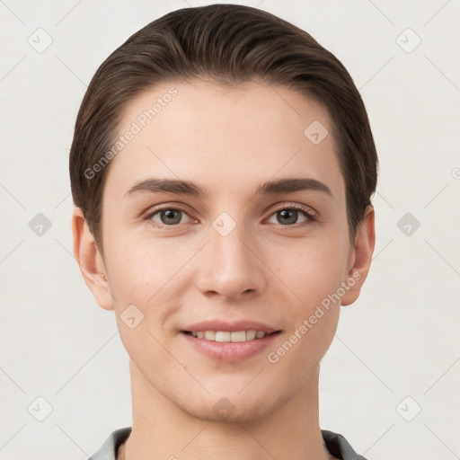 Joyful white young-adult female with short  brown hair and grey eyes