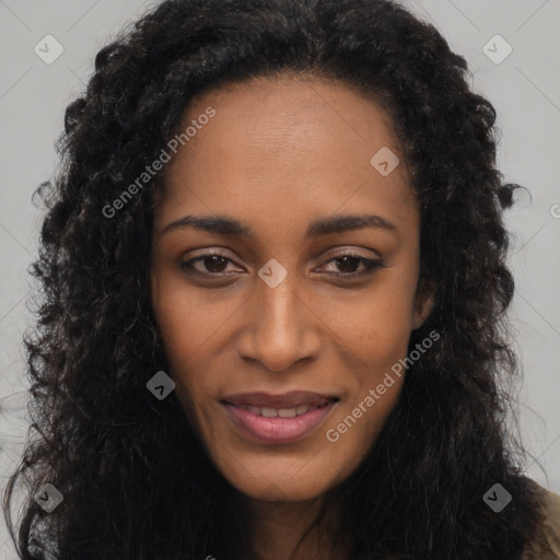 Joyful black young-adult female with long  brown hair and brown eyes