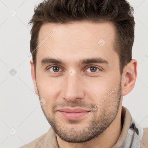 Joyful white young-adult male with short  brown hair and brown eyes