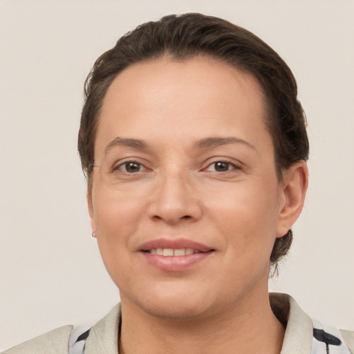 Joyful white young-adult female with short  brown hair and brown eyes