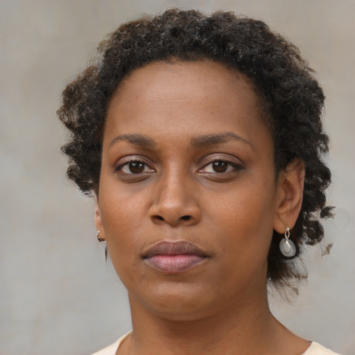 Neutral black young-adult female with short  brown hair and brown eyes