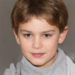 Joyful white child male with short  brown hair and brown eyes