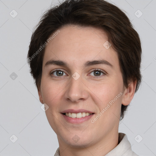 Joyful white young-adult female with short  brown hair and brown eyes