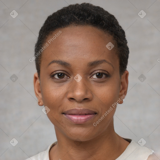 Joyful black young-adult female with short  black hair and brown eyes