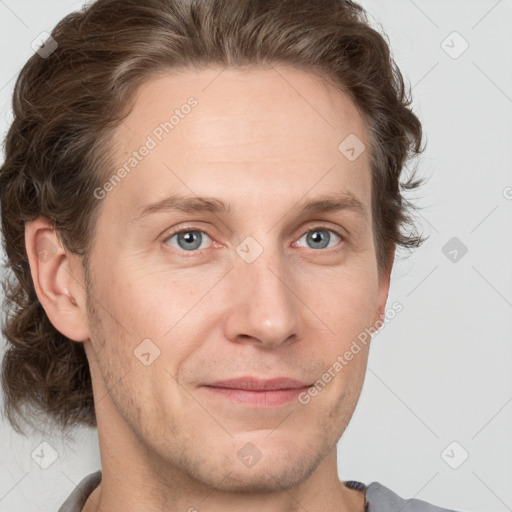 Joyful white adult male with short  brown hair and grey eyes