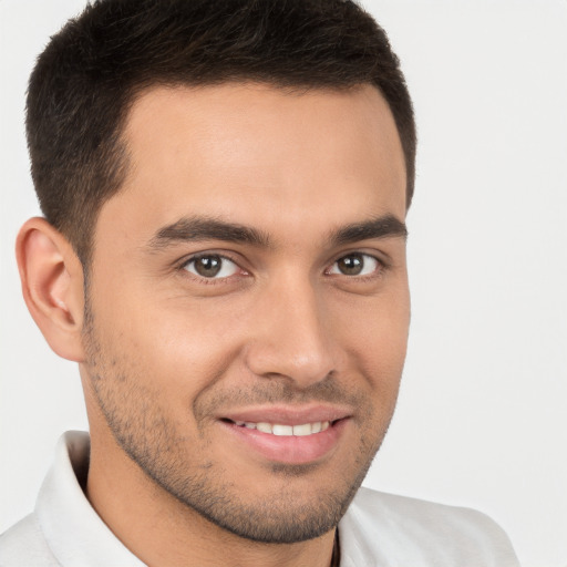 Joyful white young-adult male with short  brown hair and brown eyes