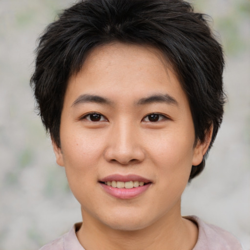 Joyful asian young-adult female with short  brown hair and brown eyes