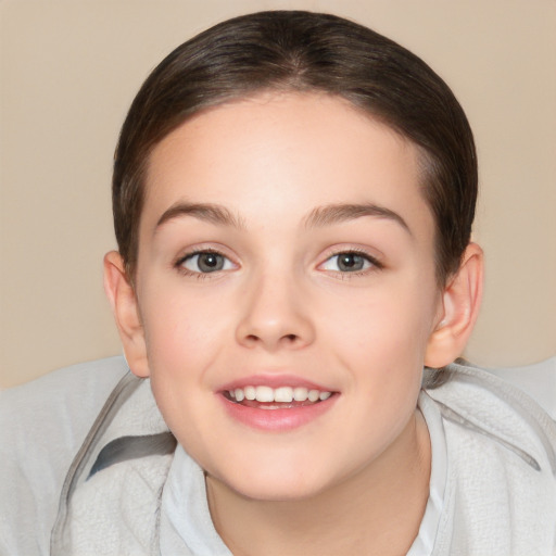 Joyful white child female with medium  brown hair and brown eyes