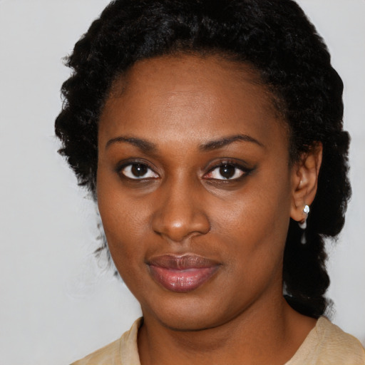 Neutral black young-adult female with medium  black hair and brown eyes