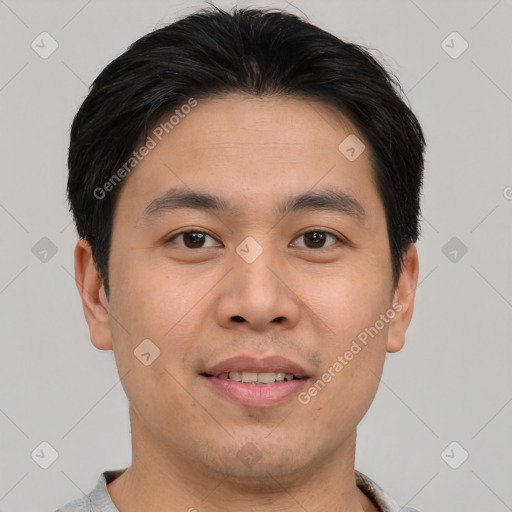 Joyful asian young-adult male with short  brown hair and brown eyes