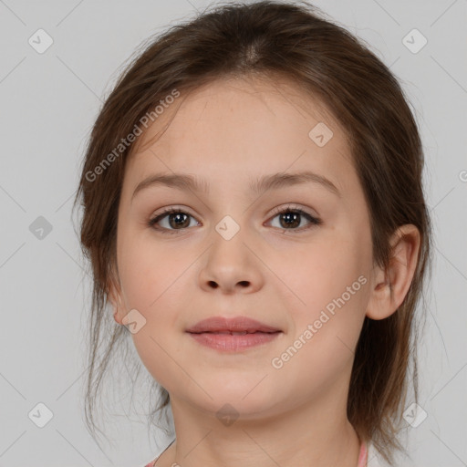 Joyful white child female with medium  brown hair and brown eyes