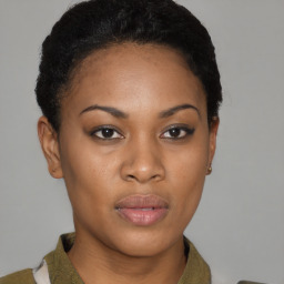 Joyful black young-adult female with short  brown hair and brown eyes