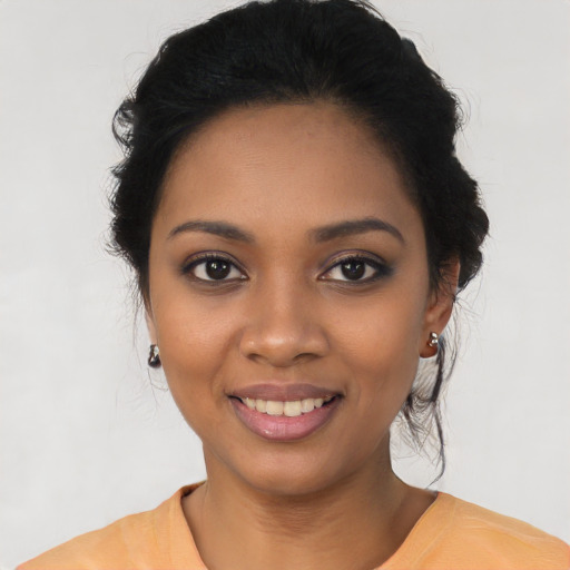 Joyful latino young-adult female with medium  black hair and brown eyes