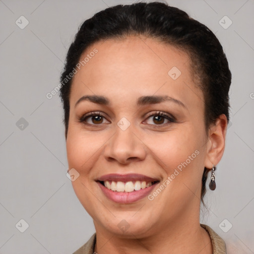 Joyful latino young-adult female with short  brown hair and brown eyes