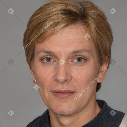 Joyful white adult female with short  brown hair and blue eyes