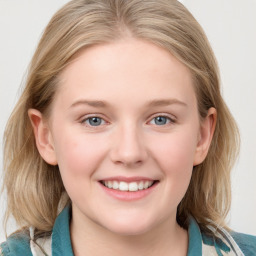 Joyful white young-adult female with medium  brown hair and blue eyes