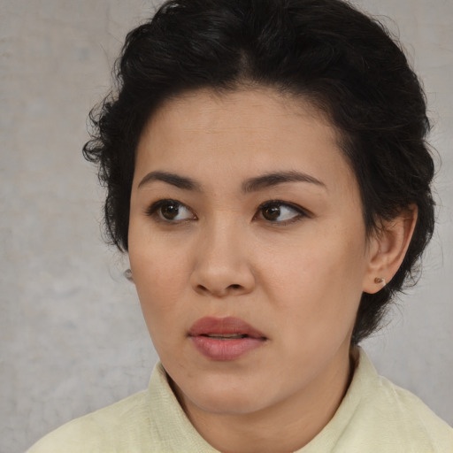 Neutral asian young-adult female with short  brown hair and brown eyes