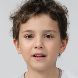 Joyful white child male with short  brown hair and brown eyes