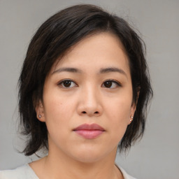 Neutral asian young-adult female with medium  brown hair and brown eyes