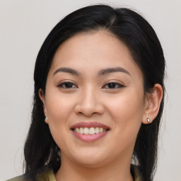 Joyful asian young-adult female with long  brown hair and brown eyes