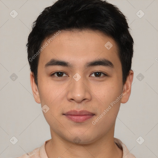 Joyful asian young-adult male with short  black hair and brown eyes