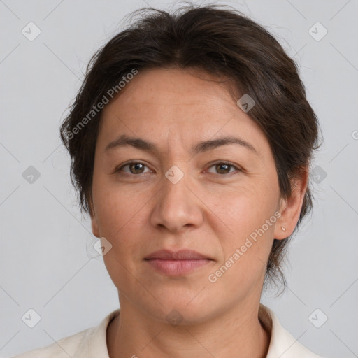 Joyful white adult female with short  brown hair and brown eyes