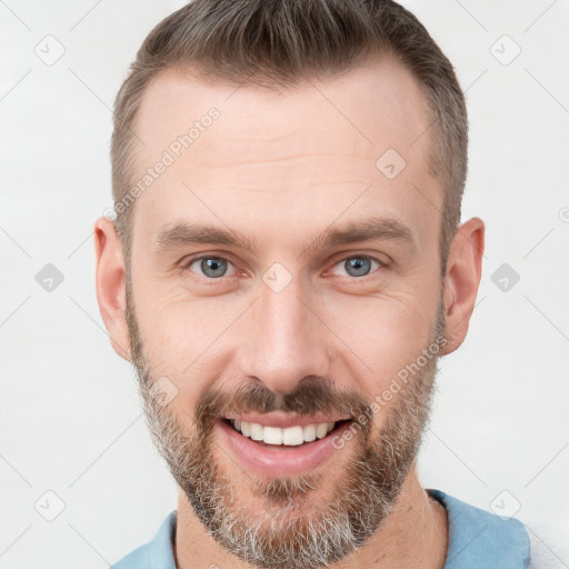 Joyful white young-adult male with short  brown hair and brown eyes