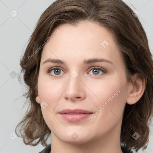 Joyful white young-adult female with medium  brown hair and green eyes