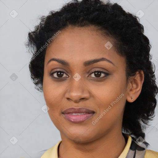 Joyful black young-adult female with long  brown hair and brown eyes