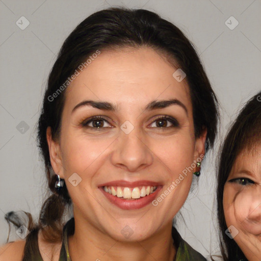 Joyful white adult female with medium  brown hair and brown eyes